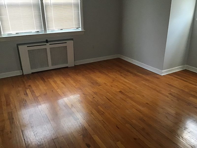 Window with blinds over a covered radiator