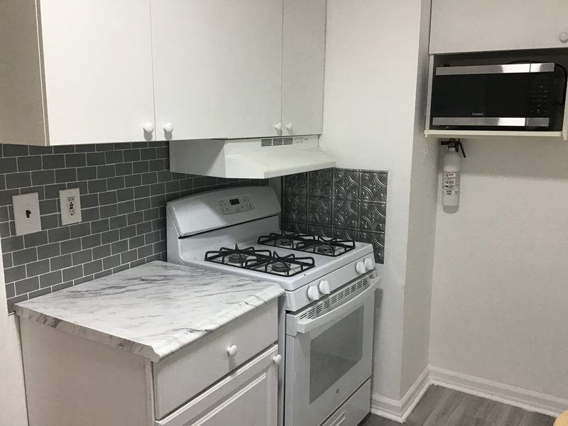 Gas stove with a range hood, and a microwave